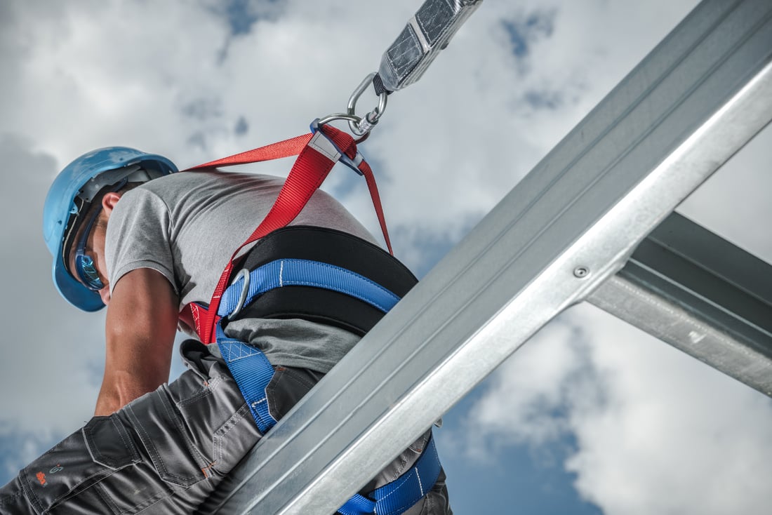 Man in Safety Harness Absorbing Lanyard