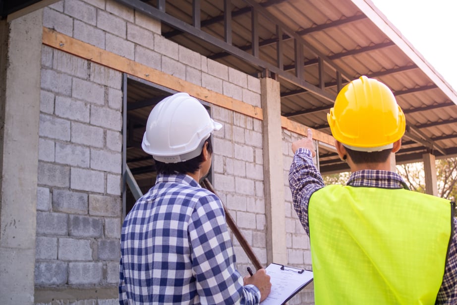 Engineers Inspecting a House